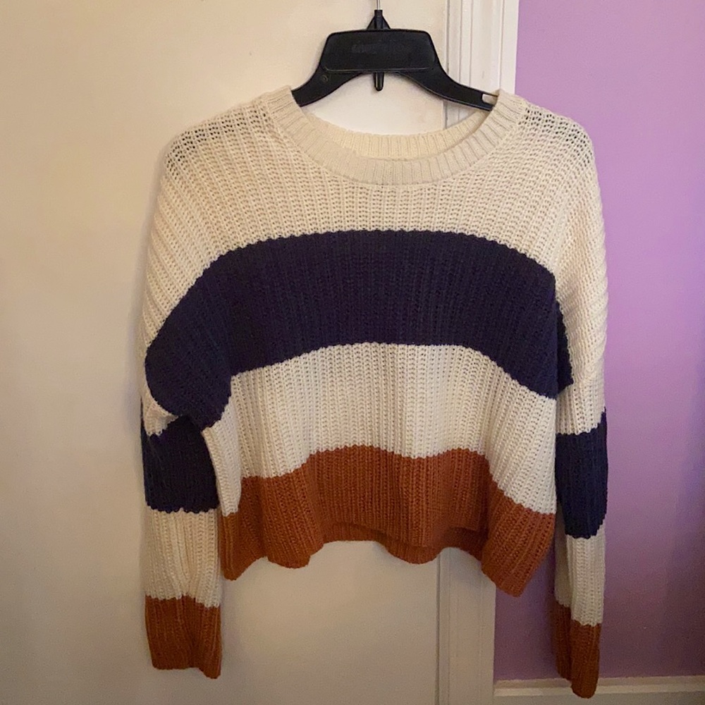 Soft blue, brown, and cream colored sweater